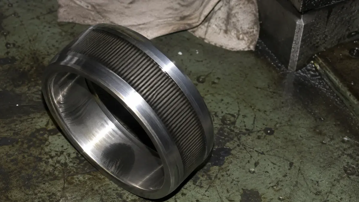 Fluting damage on a bearing inner ring, the parallel washboard pattern left by electrical discharge through the lubricant film in an inverter-driven motor, which raises bearing noise as it develops